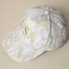 Cap with gold 'USA' text and camo pattern 