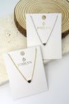 Two heart necklaces on display cards 