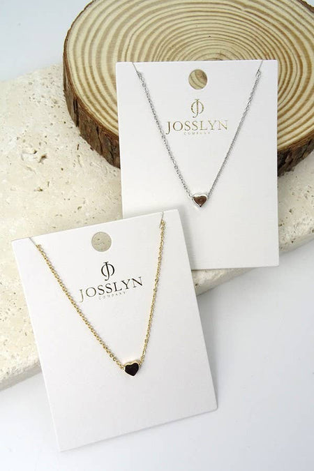 Two heart necklaces on display cards 