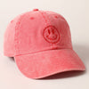 Red cap with a smiley face design 