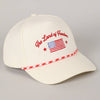 White cap with 'The Land of Freedom' text and American flag design 