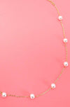 Pearl necklace on a gold chain 