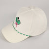 White cap with green and pink design 