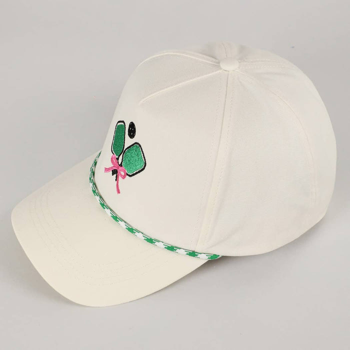 White cap with green and pink design 