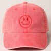 Red cap with a smiley face design 