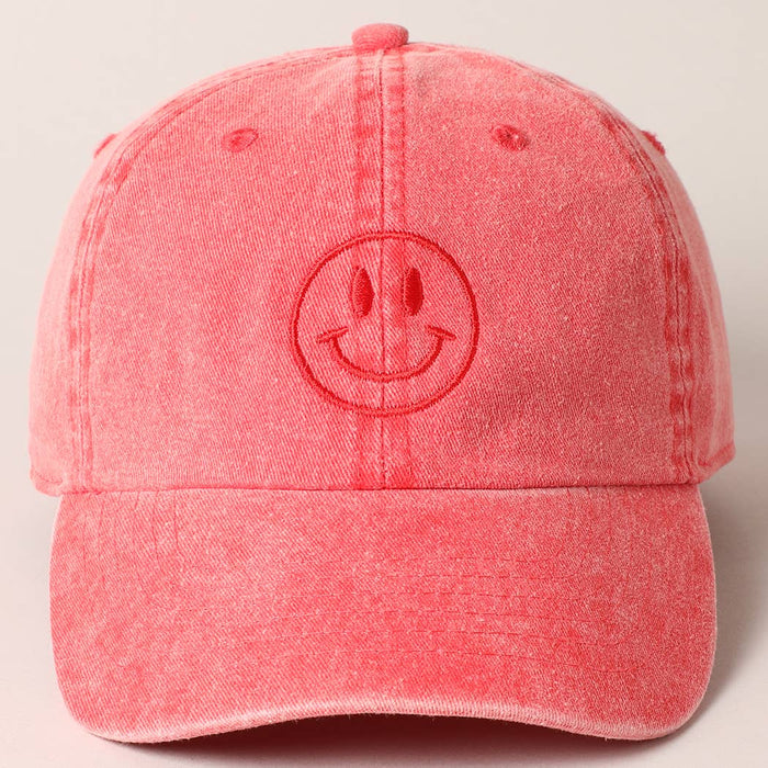 Red cap with a smiley face design 