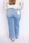 Person wearing light blue jeans 