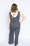 Woman wearing a gray jumpsuit 
