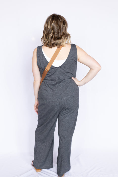 Woman wearing a gray jumpsuit 