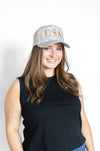 Woman wearing a cap with 'USA' text 