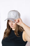 Woman wearing a gray cap with 'USA' text 