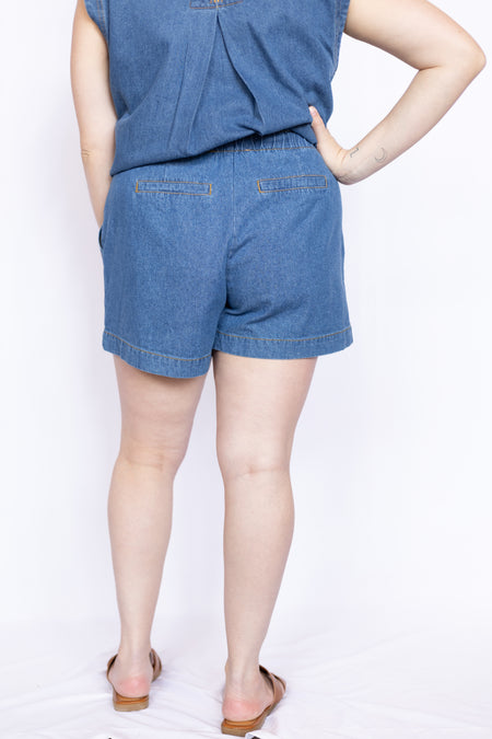 Person wearing a blue denim outfit 