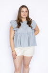 light blue ruffle babydoll blouse with white high waisted shorts 
