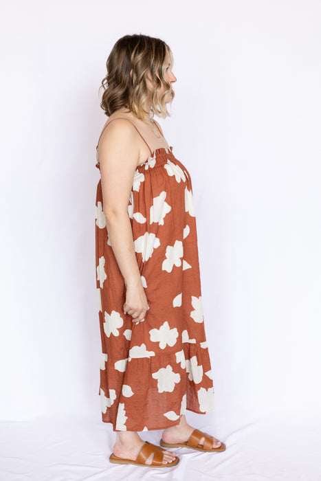Rust Cloud Print Smocked Mini Dress with brown open sandals