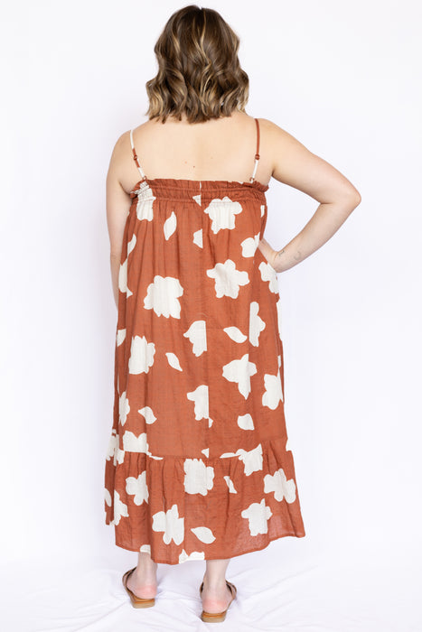 Rust Cloud Print Smocked Mini Dress with brown open sandals