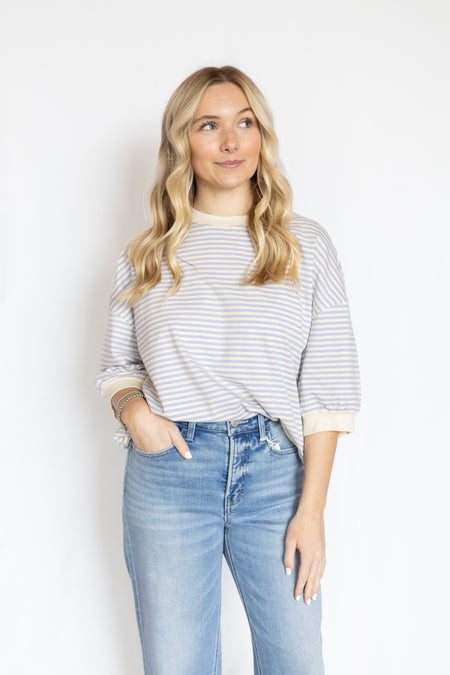 Woman wearing a striped shirt and jeans 