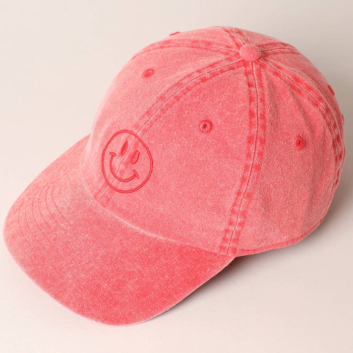 Red cap with a smiley face design 