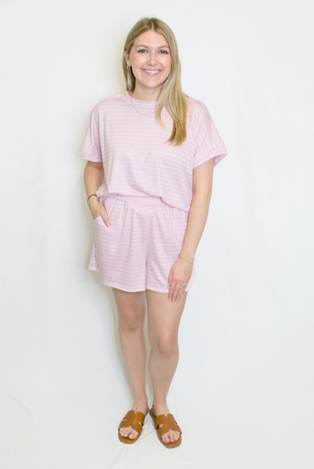Woman wearing a pink outfit set