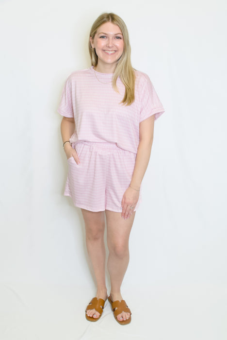 Woman wearing a pink outfit set