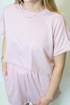 Person wearing a pink checkered outfit 