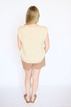button down knit sleeveless top with mauve shorts and brown sandals