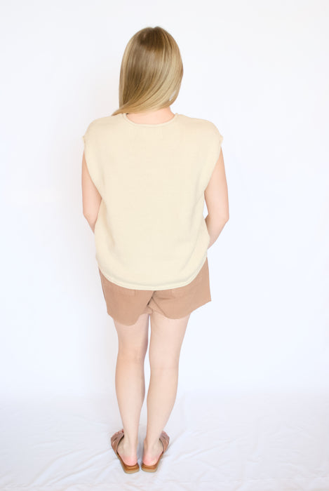 button down knit sleeveless top with mauve shorts and brown sandals
