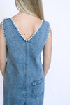 Blue denim jumpsuit with white trim 