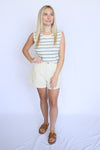 Woman wearing a striped shirt and shorts 