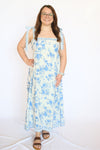Woman wearing a blue floral dress 
