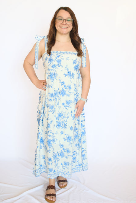 Woman wearing a blue floral dress 