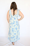 Woman wearing a blue floral dress 