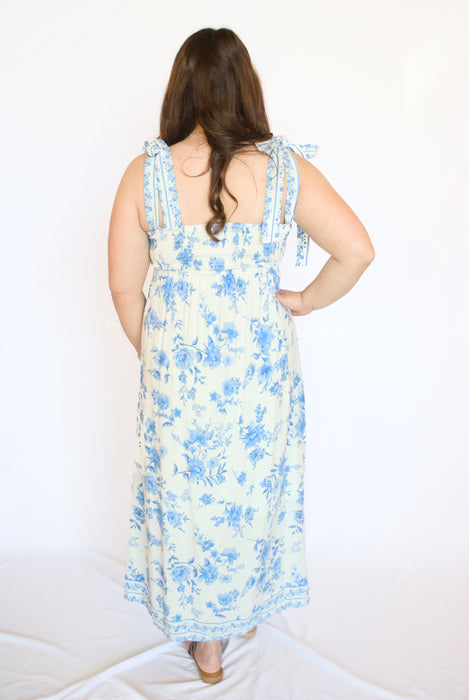 Woman wearing a blue floral dress 