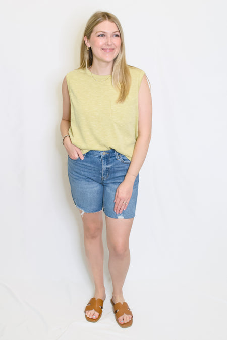 lime green ribbed top and jean shorts