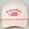 White cap with 'The Land of Freedom' text and American flag design 