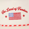 Embroidered design with 'The Land of Freedom' text and American flag 